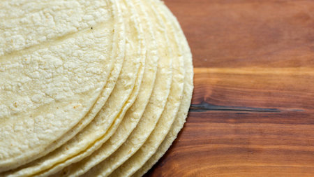 Mexican corn tortillas on a wooden table. Selective focus.の写真素材