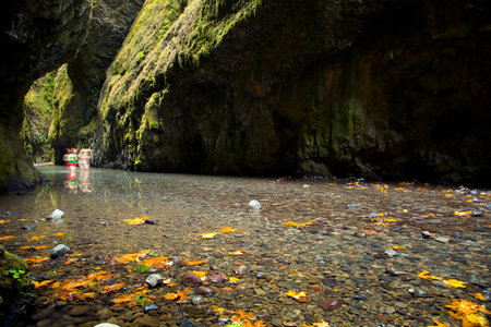 Beautiful landscape of a river flowing through a cave in the mountainsの写真素材