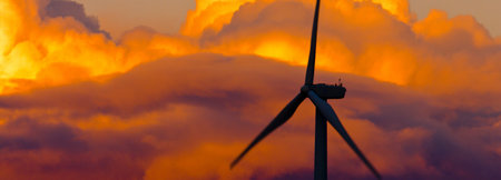 An image of windturbine generator on beautiful sunset sky backgroundの写真素材