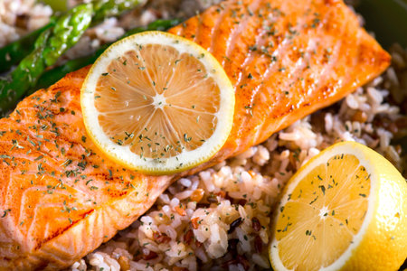 Salmon with brown rice, green asparagus and lemon.の写真素材