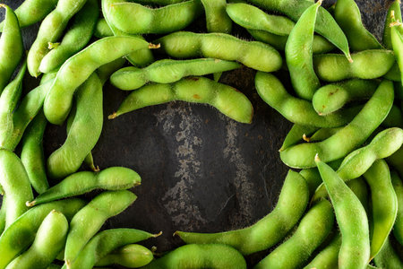 Green soybeans on rustic background, top view, copy spaceの写真素材