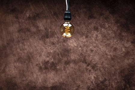 Vintage lightbulb on grunge background with copy space.の写真素材