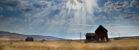 panoramic view of an old abandoned house in the prairie