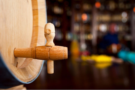 Wooden barrel with a human figure in the pub. Selective focus.の写真素材