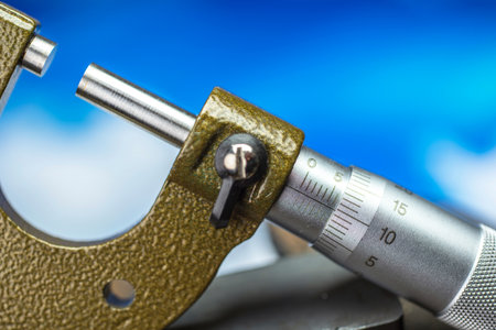 Micrometer close-up on blue sky background with copy spaceの写真素材