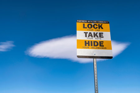 Close up of a LOCKIE TAKE HIDE sign on a sunny day.