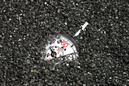 Stopwatch on the background of the asphalt road. Close-upの写真素材