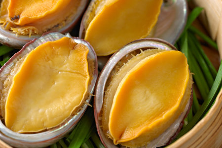 Close up of fresh scallops in bamboo basket, Thailand.の写真素材