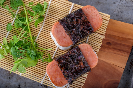 Sushi roll with salmon, nori and coriander.の写真素材