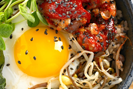 Bibimbap with rice and fried egg, close-upの写真素材