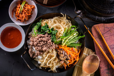 Bibimbap, Korean style hot pot with egg and vegetablesの写真素材
