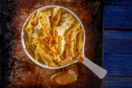 Creamy grated cheese in a bowl with toasted breadの写真素材