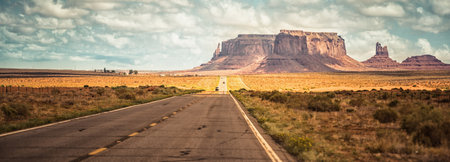 Monument Valley, Arizona, USA. Panoramic view of the road.の写真素材