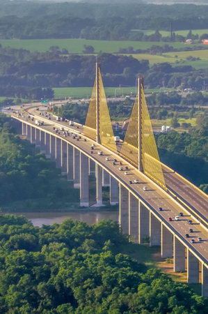 Aerial view of the bridge over the river in the morning.