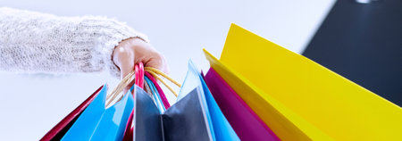 Shopping bags in female hands, close-up. Shopping conceptの写真素材