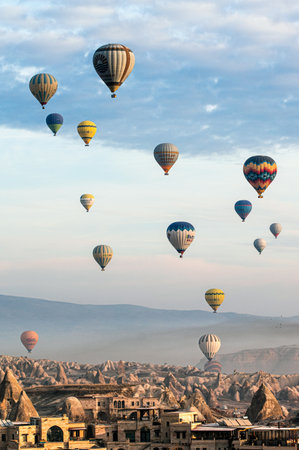 Hot air balloons flying over Cappadocia, Turkey.の写真素材