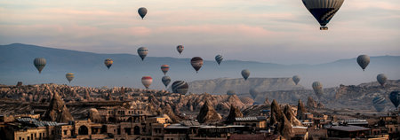 Hot air balloons flying over Cappadocia, Turkey.の写真素材