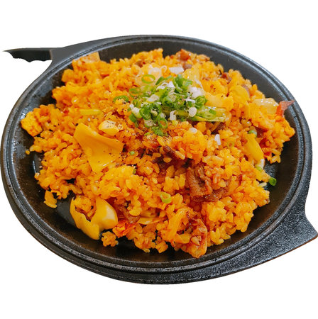 Fried rice with pork on a black plate isolated on white backgroundの写真素材