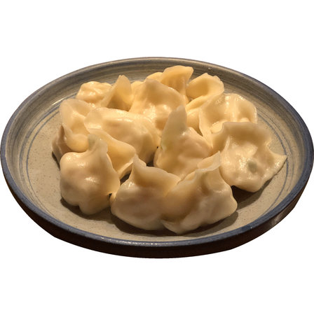 boiled dumplings on a plate isolated on white background.の写真素材