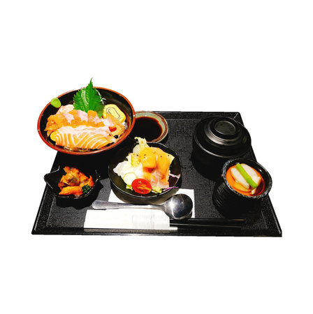 Sashimi set on a black plate isolated on a white backgroundの写真素材