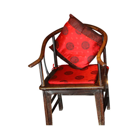 Antique chair with red pillow isolated on white background with clipping pathの写真素材