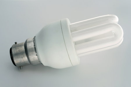 Energy saving fluorescent light bulb isolated on white background with clipping path.
