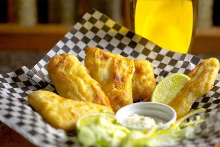 Fried chicken wings with sour cream and mayonnaise sauce.