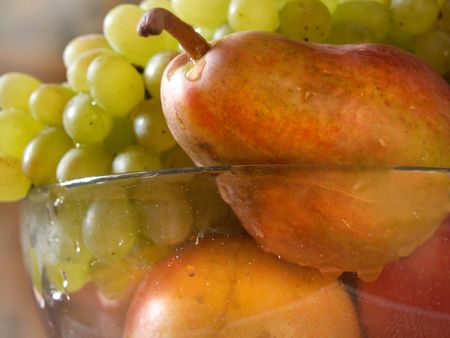fruit-piece with the bunch of grapes, pear and appleの写真素材