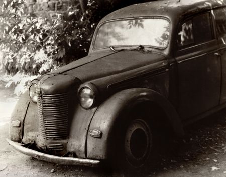 old small car with the very sorrowful eyesの写真素材
