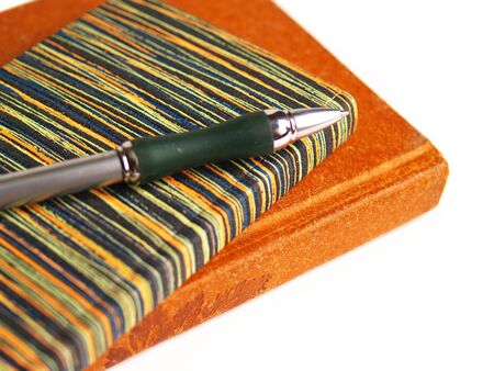 notebooks and pen on white backgroundの写真素材