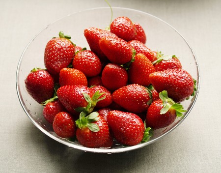 big closeup strawberries on the glass plateの写真素材