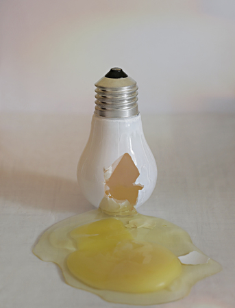Broken light bulb from its eggの写真素材