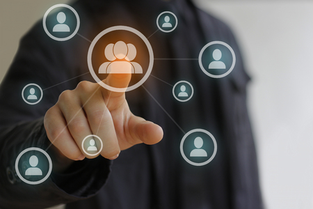 Business man in black pressing Social network iconの写真素材