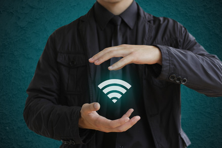 Man holding wifi iconの写真素材