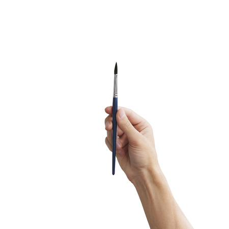 Brush in hand. Isolated on white background.の写真素材