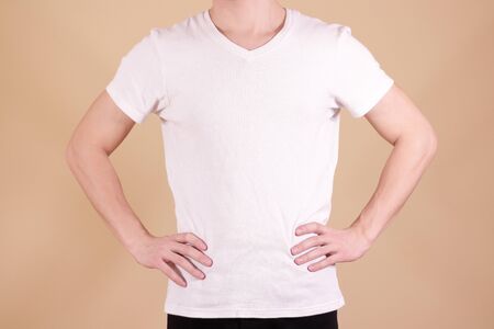White t shirt on a young man template. Hands on waist.