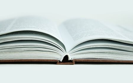 Open book, close up. Isolated on white background.の写真素材