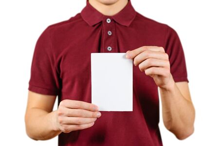 Man showing blank white flyer brochure booklet. Leaflet presentation. Pamphlet hold hands. Man show clear offset paper. Sheet template. Booklet design sheet display read first person.の写真素材