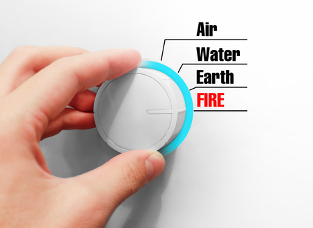 Male hand turns the switch. Switches space. Chose the Fire.の写真素材