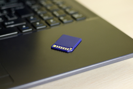 SD memory card. Blue is on the laptop