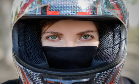 Young girl in a motorcycle helmet.の写真素材
