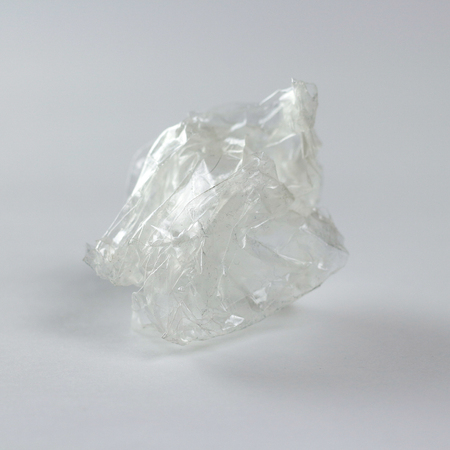 A ball of transparent tape. Isolated on grey background.の写真素材