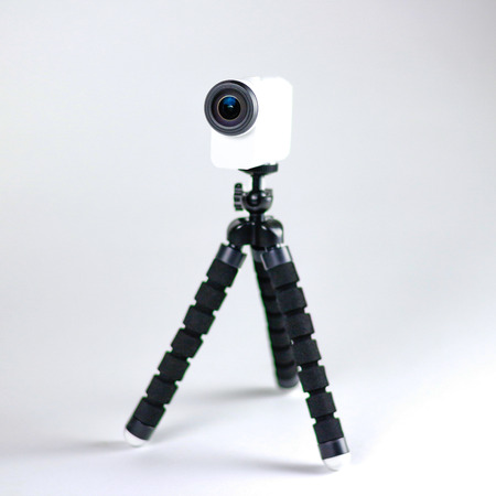 Action camera on a small tripod. Close up. Isolated on white background.の写真素材