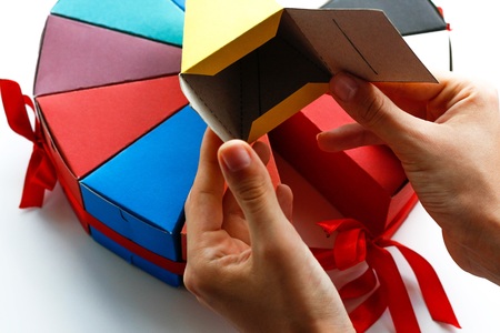 Pieces of cake made of colored paper. Paper cake. Isolated on white background. Close upの写真素材