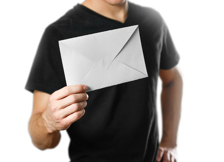 A man holding an envelope. Isolated on white background