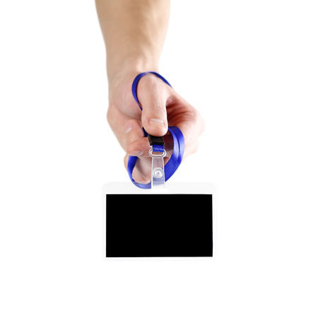 The hand holding the badge. Close up. Isolated on white background.