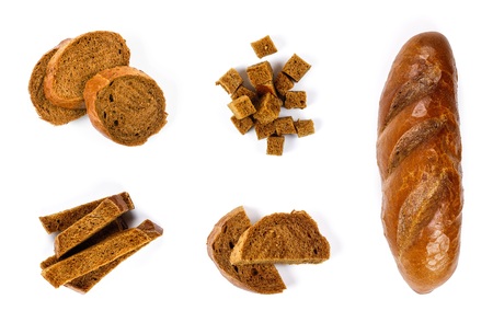 Set of loaf of dark bread, whole and sliced. Close up. Top view. Isolated on white background.