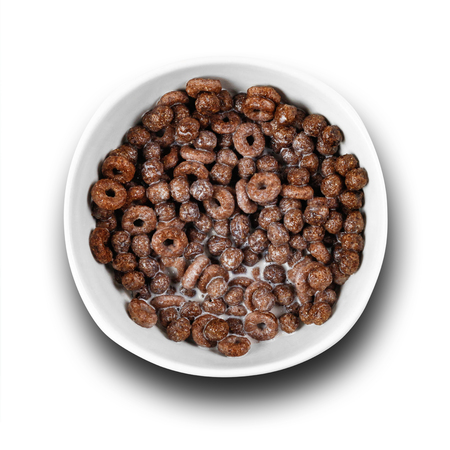 Chocolate cornflakes with milk. Close up. Top view. Isolated on white background.