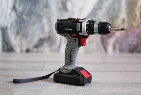 Black screwdriver with its own battery. Close up.