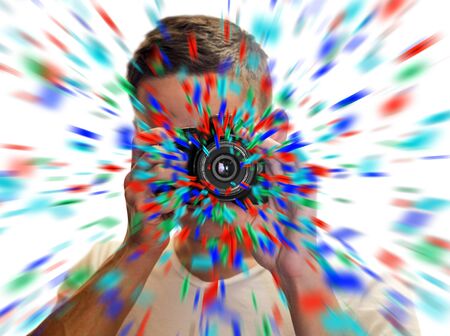 A man with a black SLR camera. Confetti flies out of the lens. Taking pictures of himself in the mirror. Selfie on the camera. Isolated on white background.の写真素材